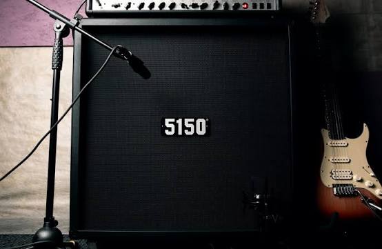 Guitar cabinet miked up next to a Stratocaster